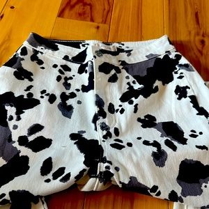 Altered State black and gray cow, print extreme flare jeans.